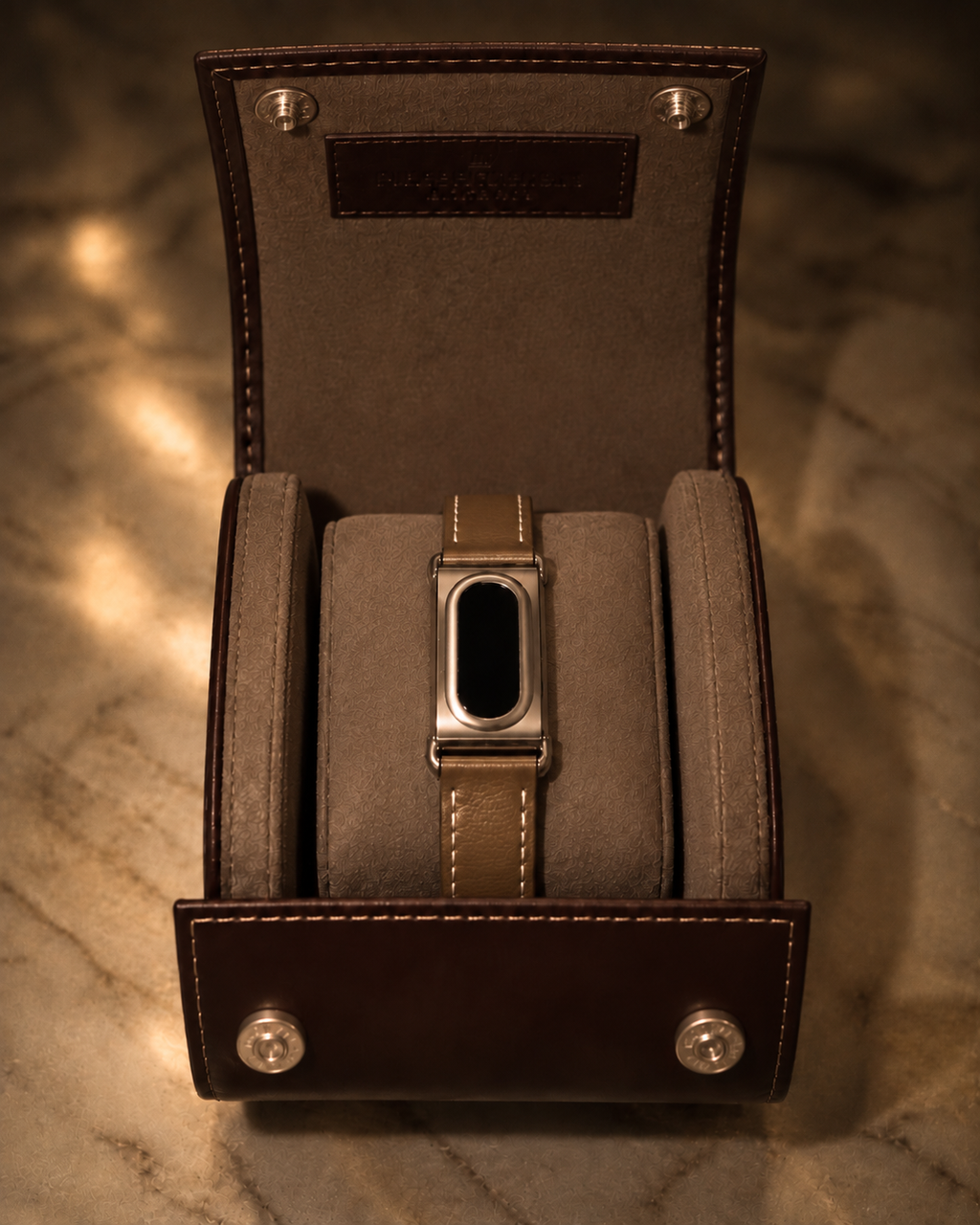 The Prenup band in Dark Brown vegan leather with a metal case, displayed in a leather watch box