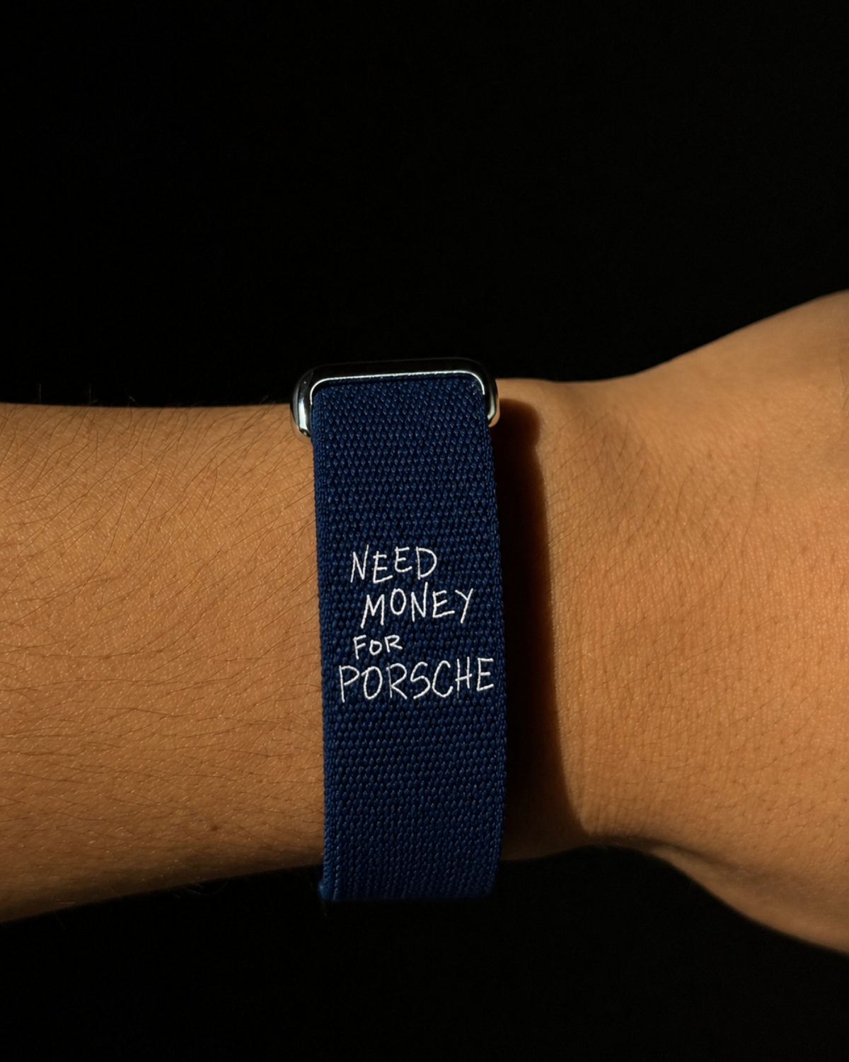Worth the Debt navy woven band worn on the wrist