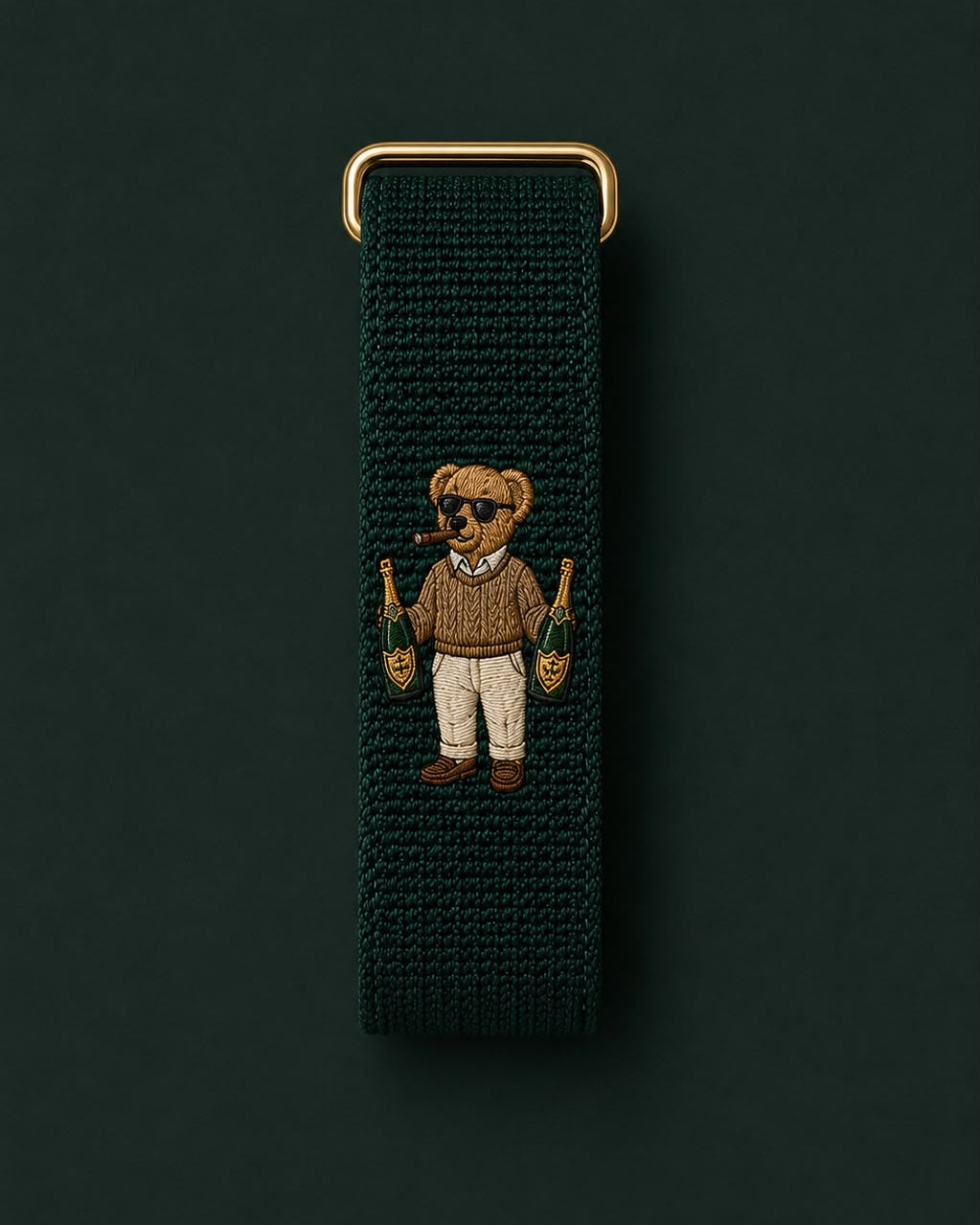Trust Fund Teddy band laid flat, showing the embroidered teddy bear and gold-tone buckle