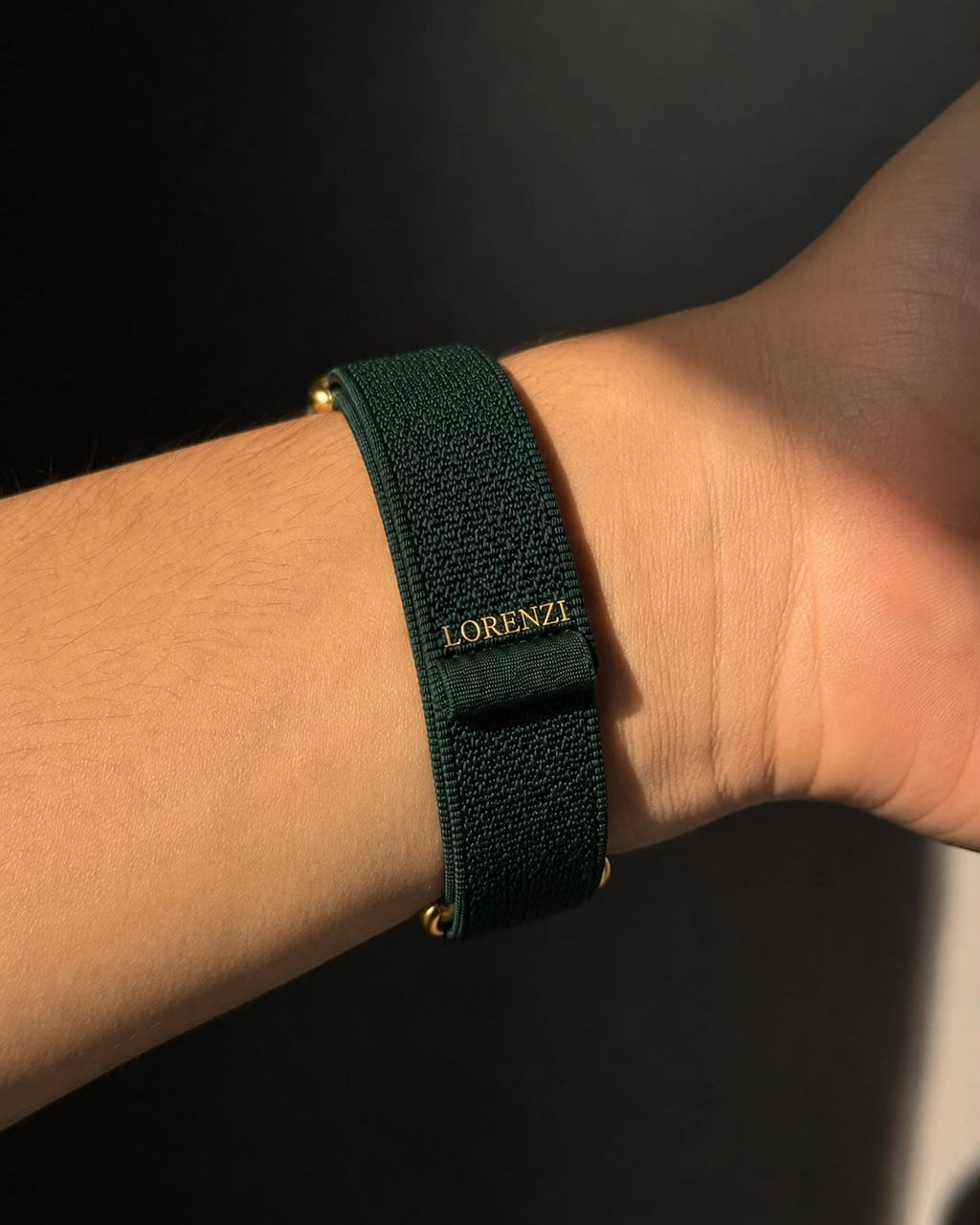 Trust Fund Teddy band on the wrist, showing the LORENZI woven label